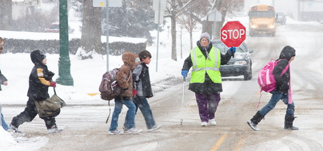Kids walking to school while it's snowing